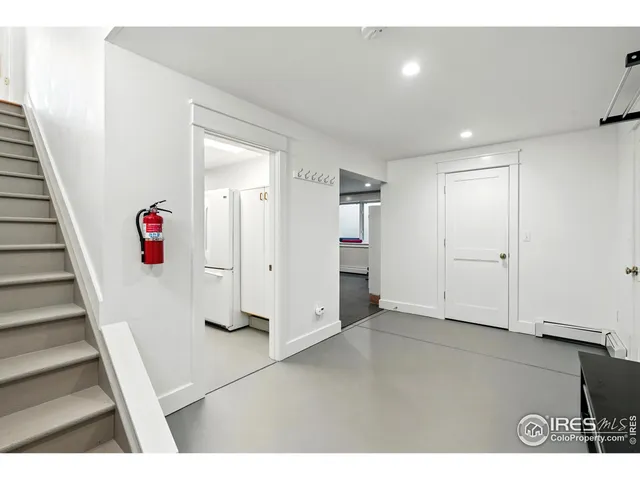 a view of an entryway with wooden floor