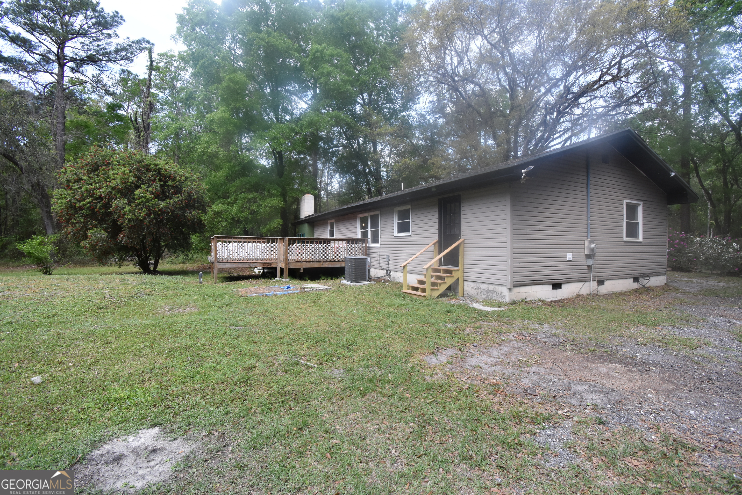 2353 Greenville Road Kingsland, GA 31548 - Photo 21 of 21 a front view of house with a garden and trees