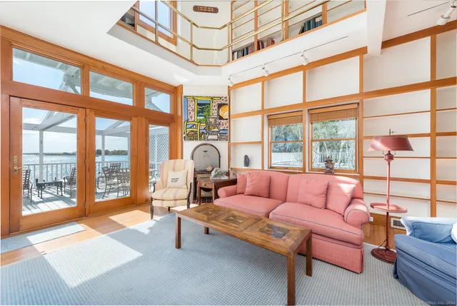 a living room with furniture fireplace and flat screen tv