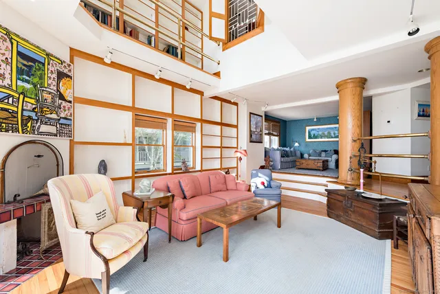 a bedroom with furniture and a window