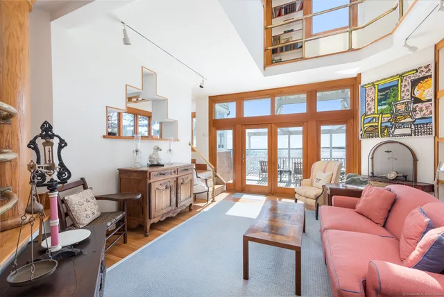 a bed room with a bed and a large white couch