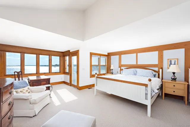 a bedroom with a bed and a table in it