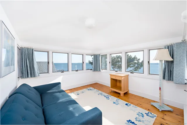 a view of a balcony with wooden floor and bridge