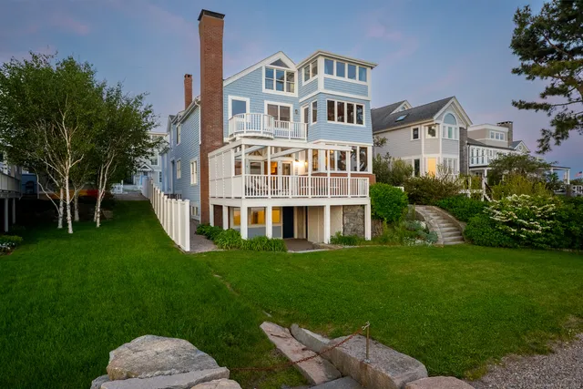 a view of a house with outdoor space and ocean view