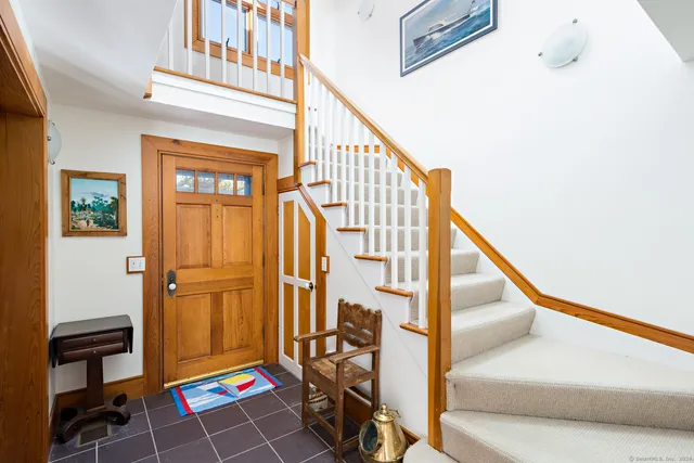a large white kitchen with a large window