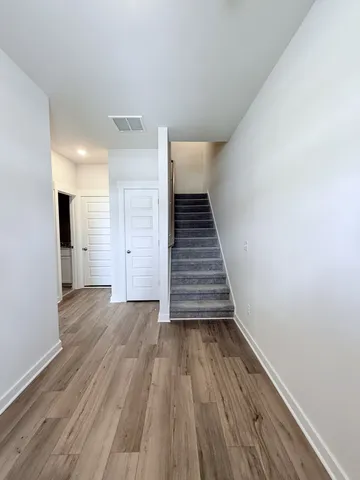 a view of staircase with white walls