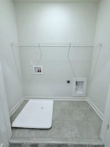 a kitchen with stainless steel appliances a refrigerator and wooden floor