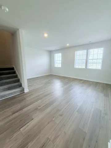 a bathroom with a double vanity sink toilet mirror and bathtub