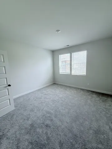 a bathroom with a double vanity sink and mirror