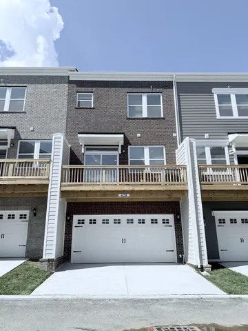 a front view of a building with a garage
