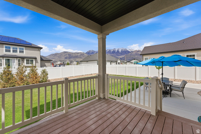 1434 West Stable Street Lindon, UT 84042 - Photo 49 of 76 Deck with outdoor dining space, a fenced backyard, a mountain view, and a residential view