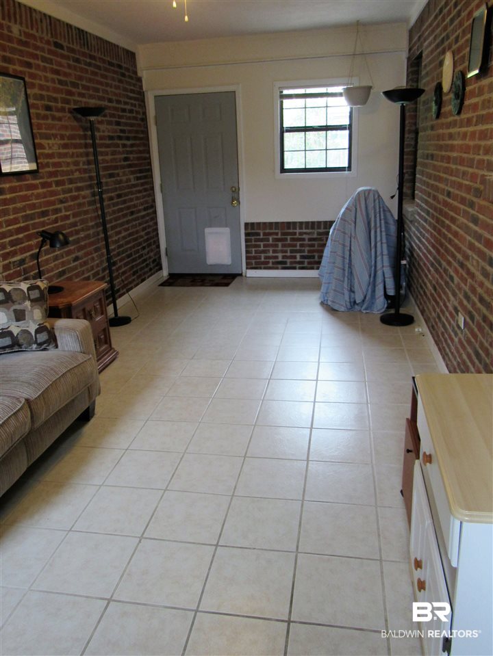 510 Ariel Avenue Foley, AL 36535 - Photo 8 of 18 Room between kitchen and garage. Great potential!