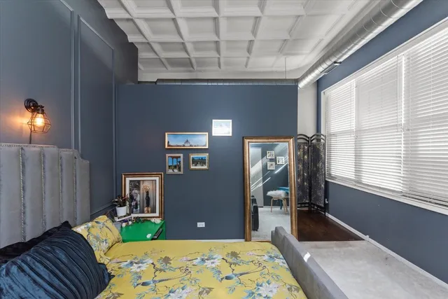 a bed room with a bed and a television