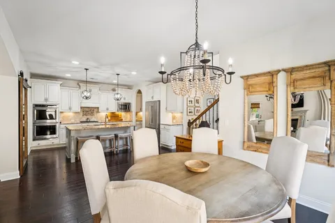 a kitchen with sink and refrigerator