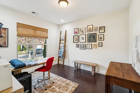 a workspace with furniture and a window