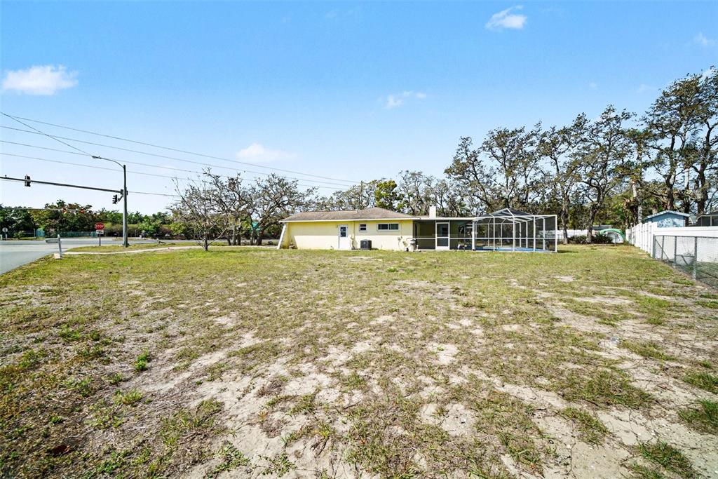 113 Ruskin Avenue Spring Hill, FL 34606 - Photo 32 of 32 a house with swimming pool in front of it