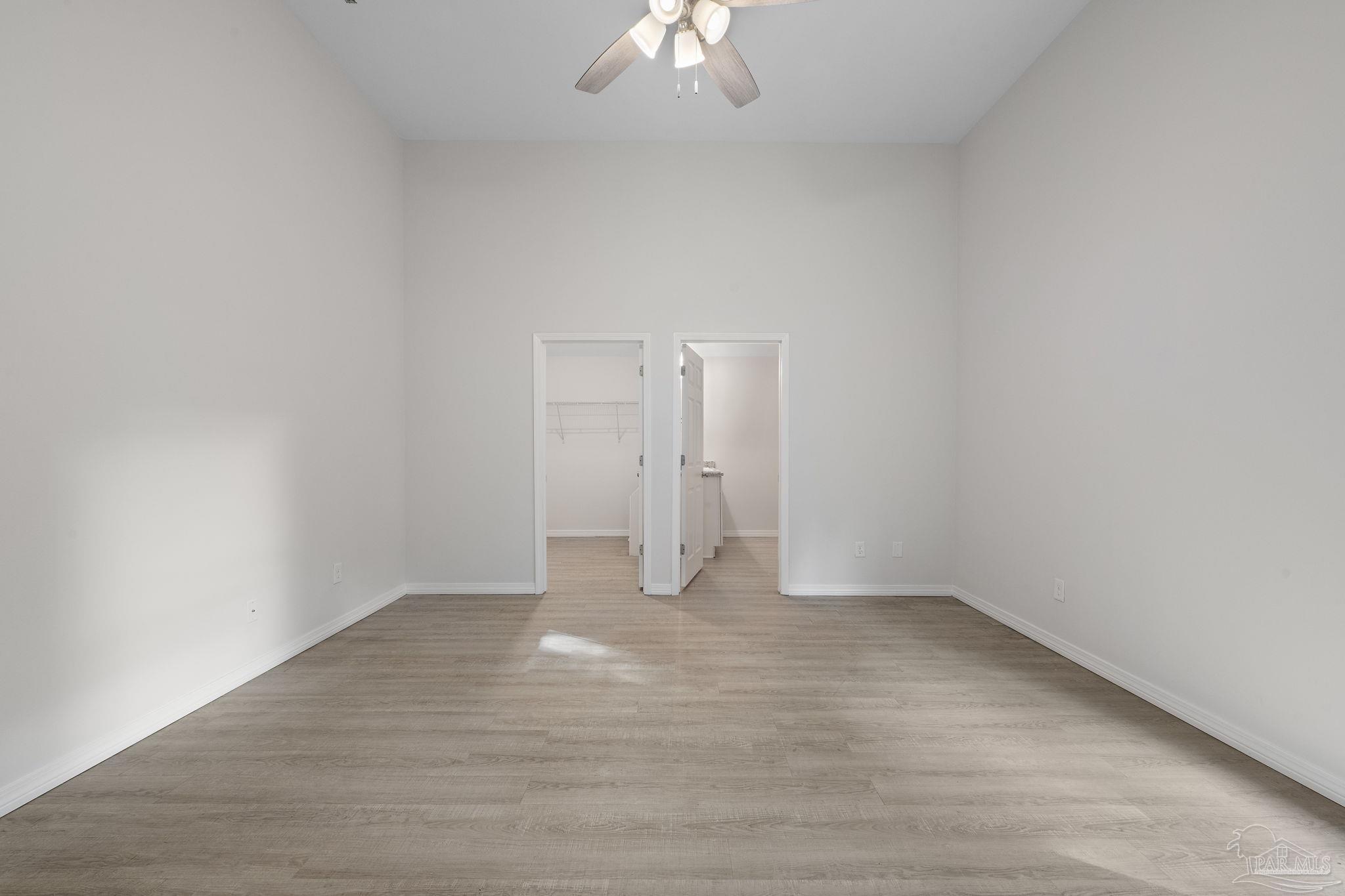 1039 Isabella Road Cantonment, FL 32533 - Photo 14 of 37 a view of an empty room with a chandelier fan