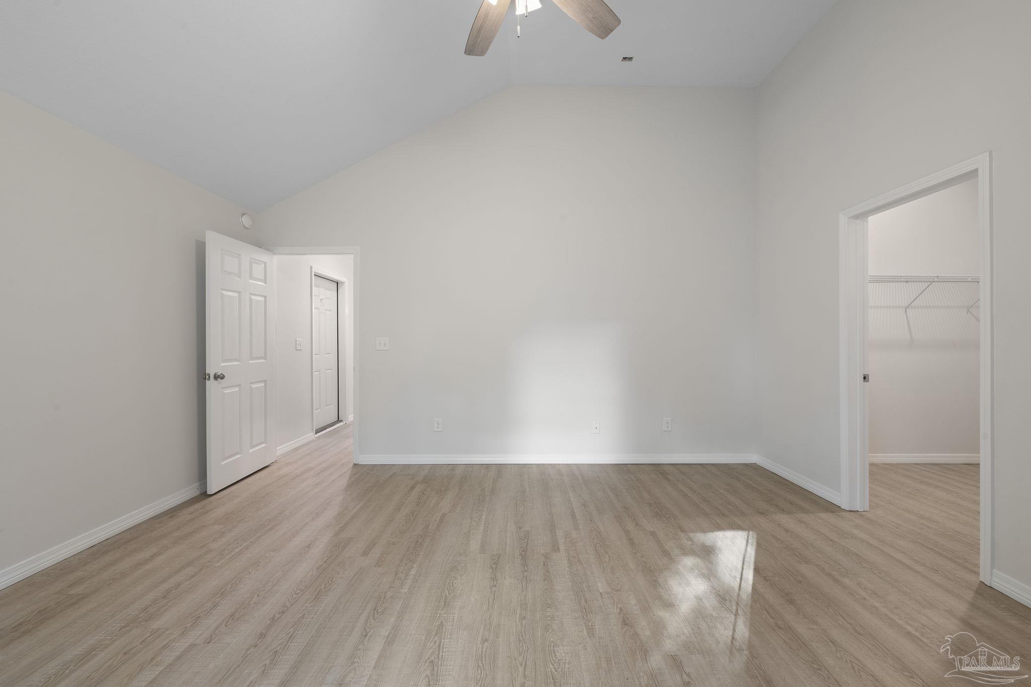 1039 Isabella Road Cantonment, FL 32533 - Photo 16 of 37 a view of an empty room with wooden floor