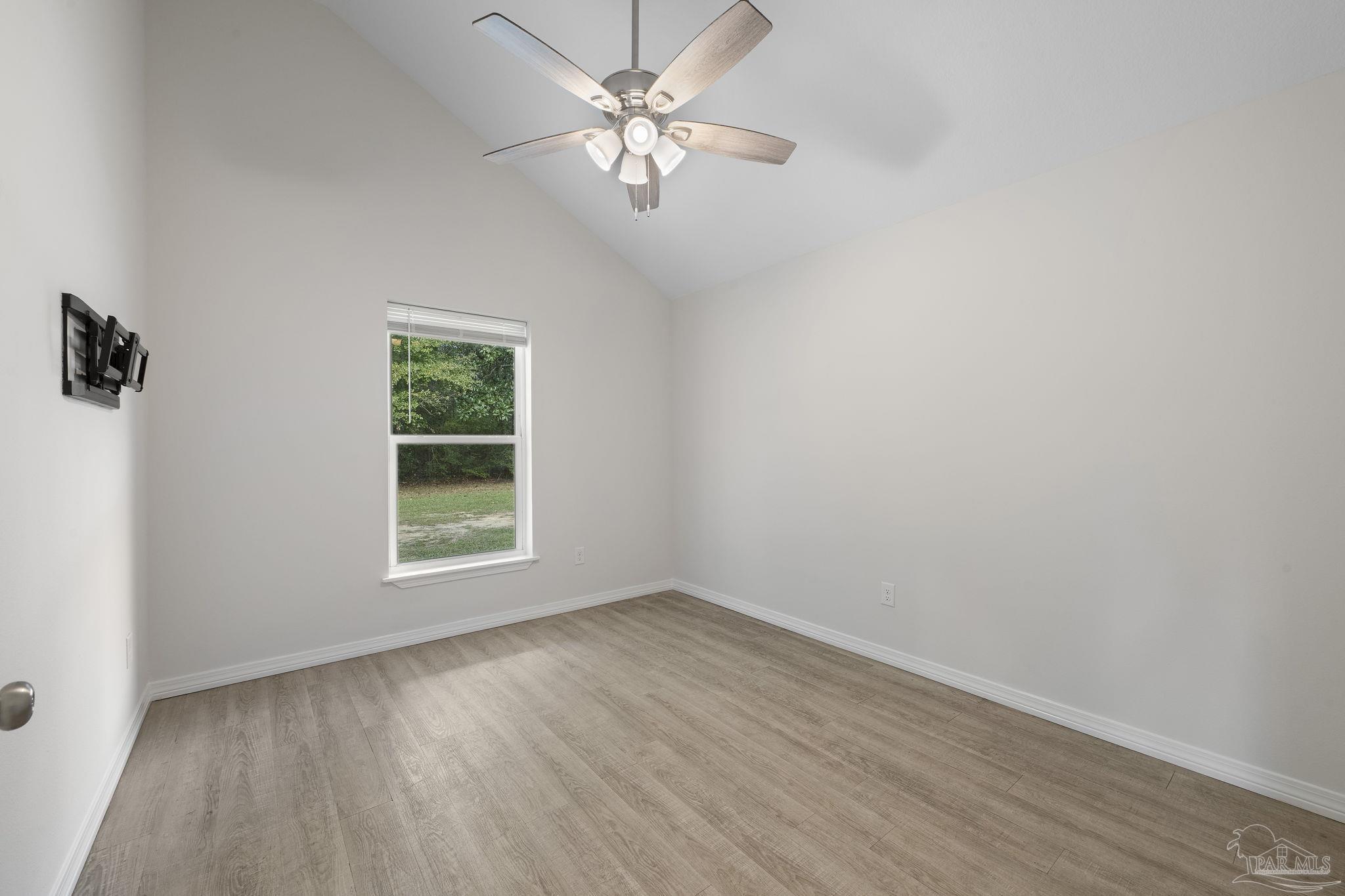 1039 Isabella Road Cantonment, FL 32533 - Photo 24 of 37 an empty room with a window and a fan