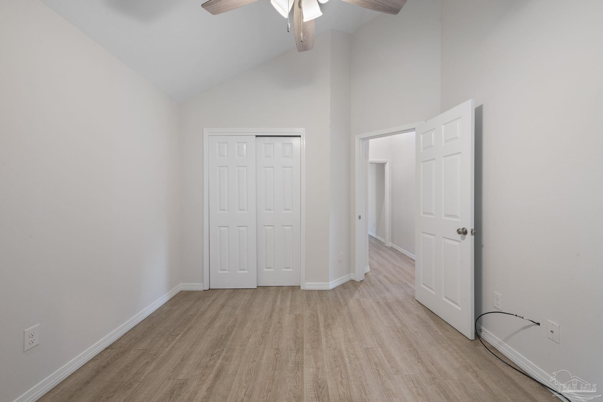 1039 Isabella Road Cantonment, FL 32533 - Photo 25 of 37 a view of a room with wooden floor