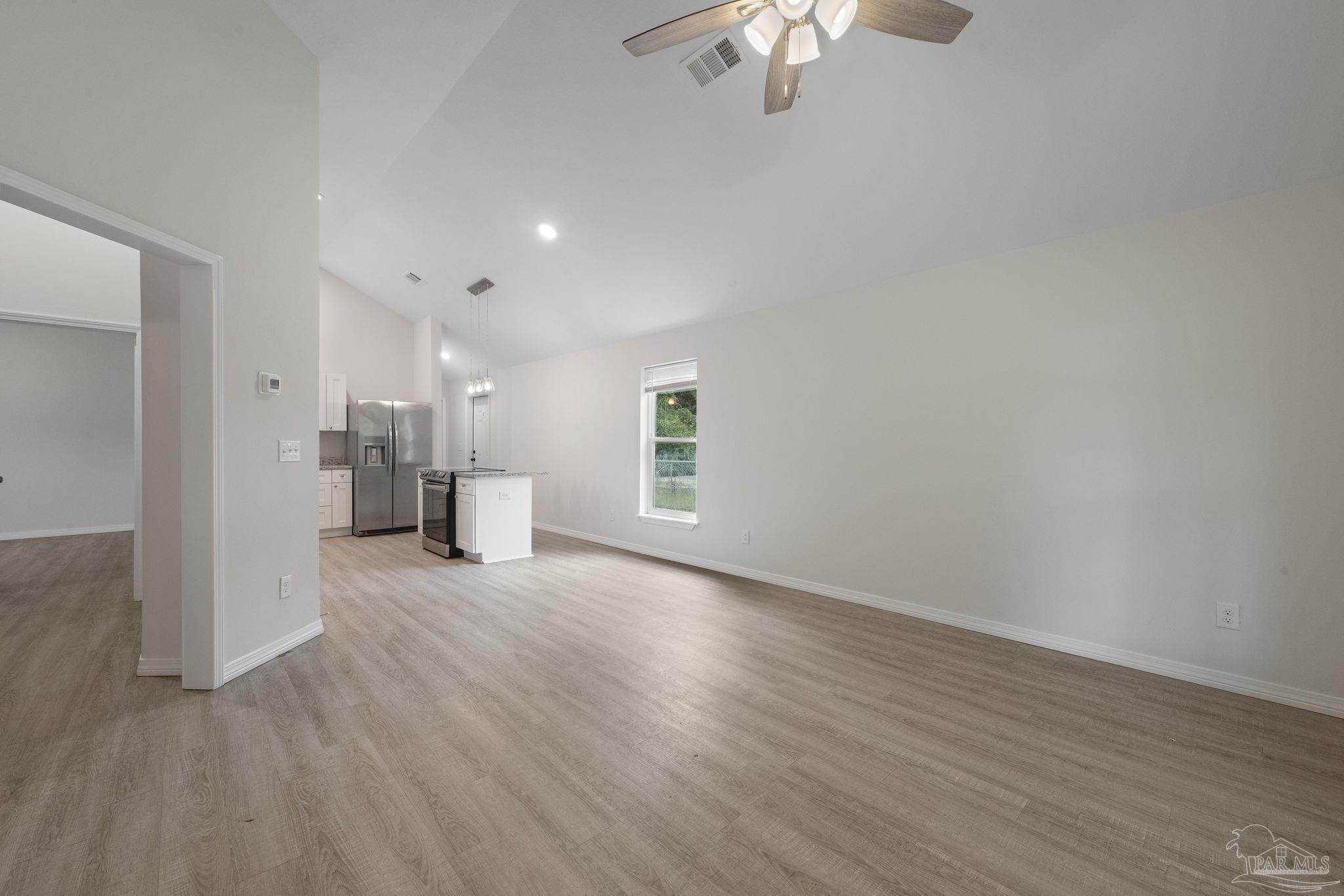 1039 Isabella Road Cantonment, FL 32533 - Photo 4 of 37 a view of empty room with wooden floor