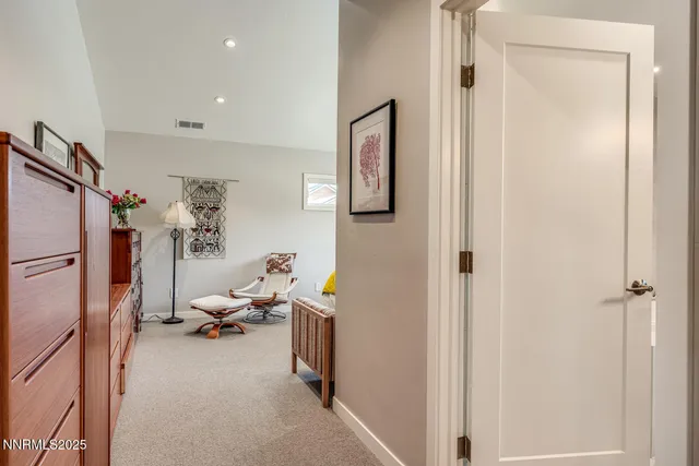 a spacious bathroom with a tub sink and mirror
