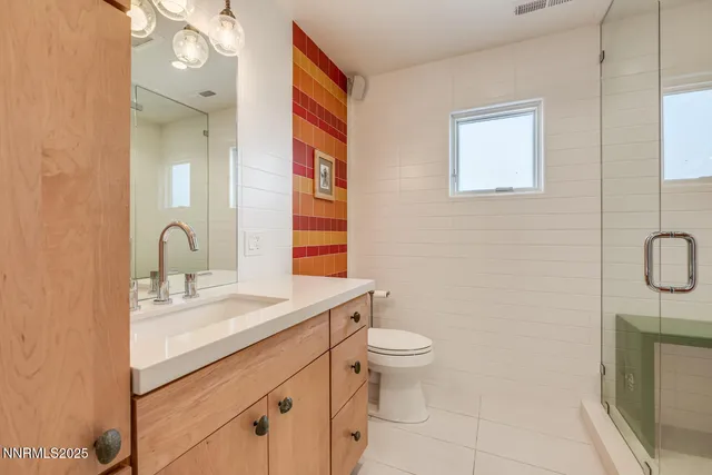 a bathroom with a shower and a shower