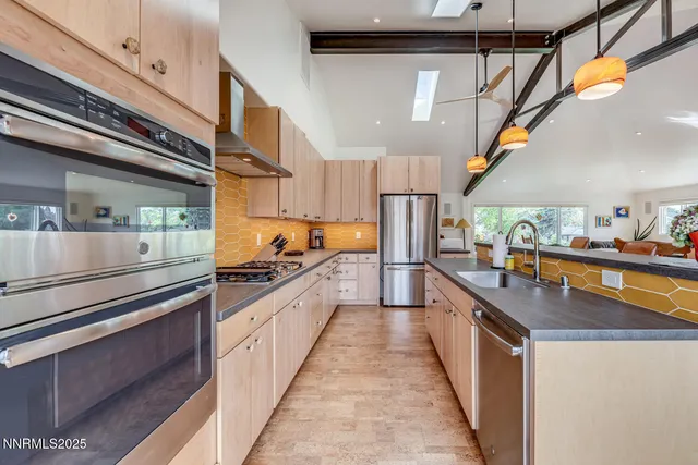 a kitchen with stainless steel appliances granite countertop lots of counter top space