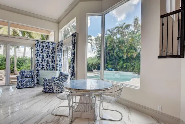 a dining room with furniture and wooden floor