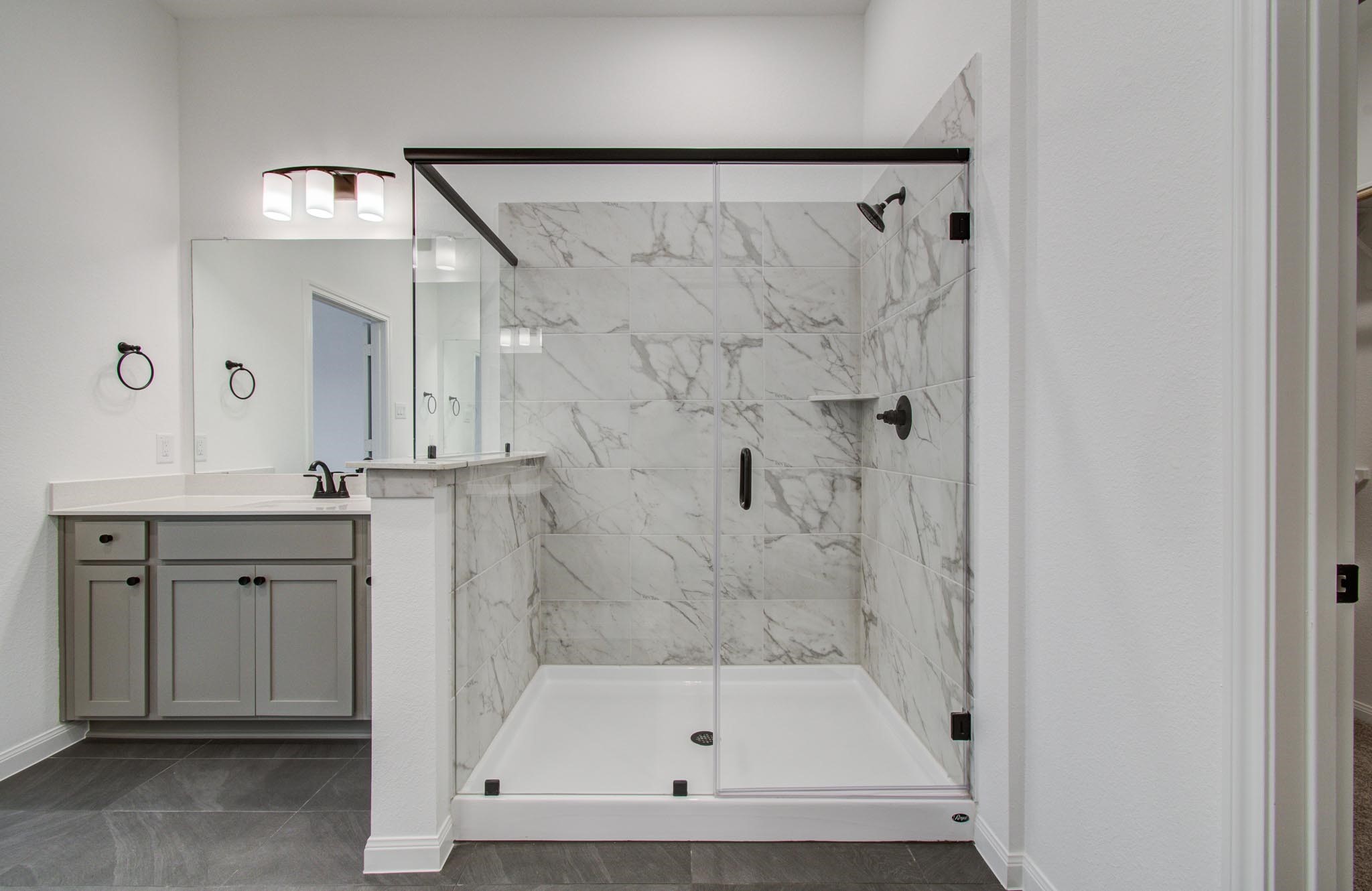 7231 Yarrow Blossom Court Katy, TX 77493 - Photo 30 of 49 a bathroom with a shower and a sink