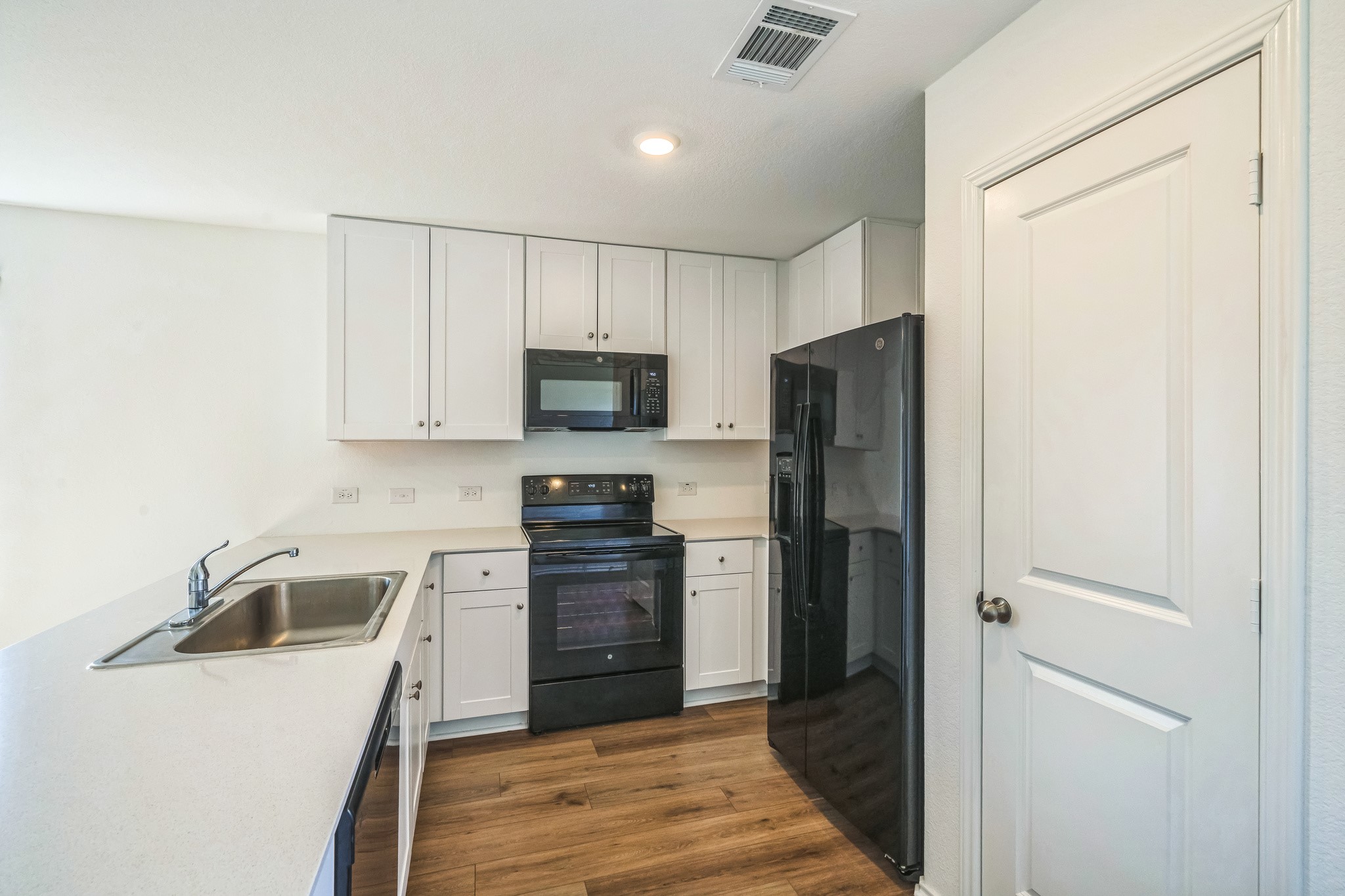 505 Sergeant Murphy Road Jarrell, TX 76537 - Photo 7 of 16 a kitchen with a refrigerator sink and cabinets