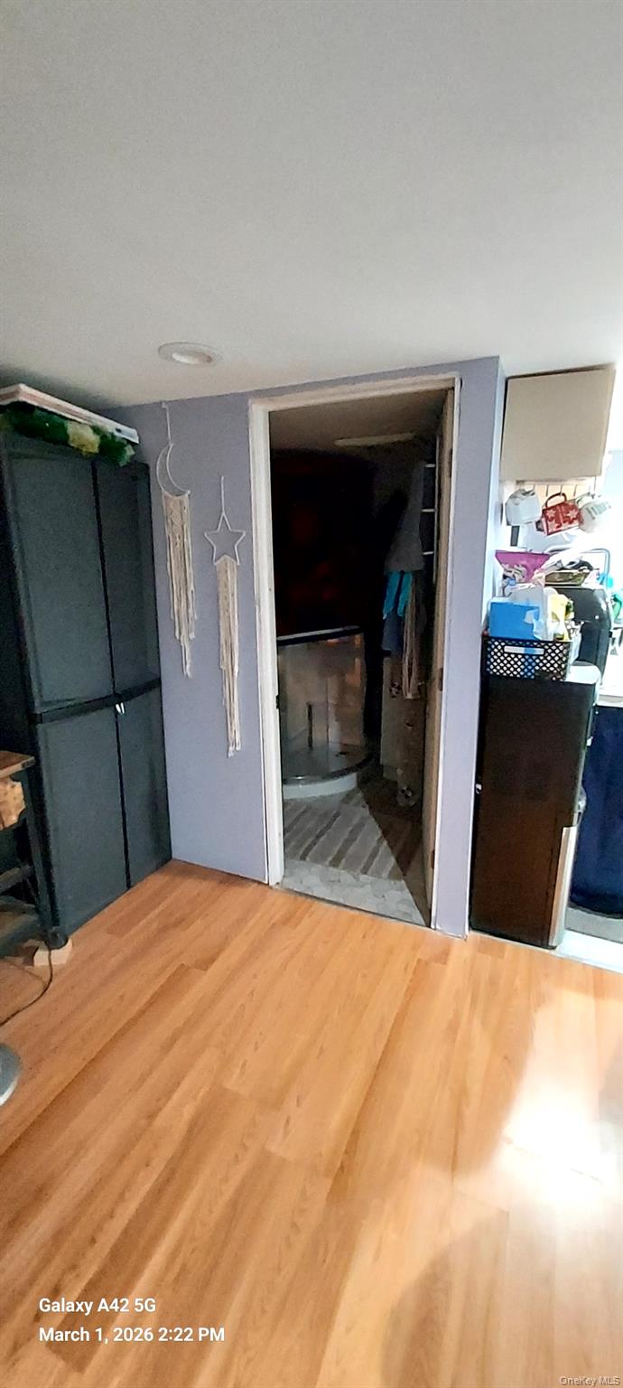 120 Stackyard Drive Mastic Beach, NY 11951 - Photo 13 of 17 a bedroom with a bed and a mirror