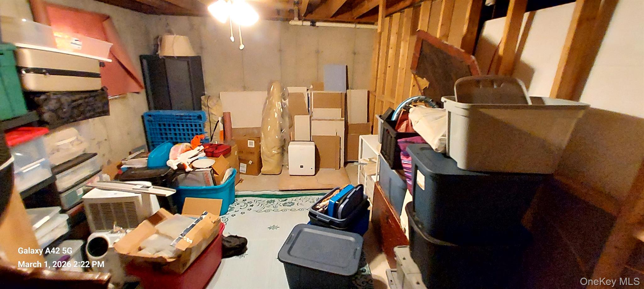 120 Stackyard Drive Mastic Beach, NY 11951 - Photo 14 of 17 a living room with furniture and a flat screen tv