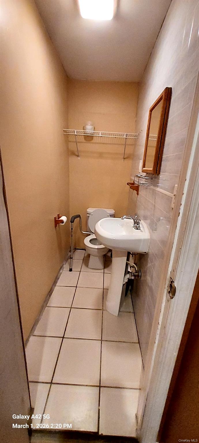 120 Stackyard Drive Mastic Beach, NY 11951 - Photo 15 of 17 a room with table and chair