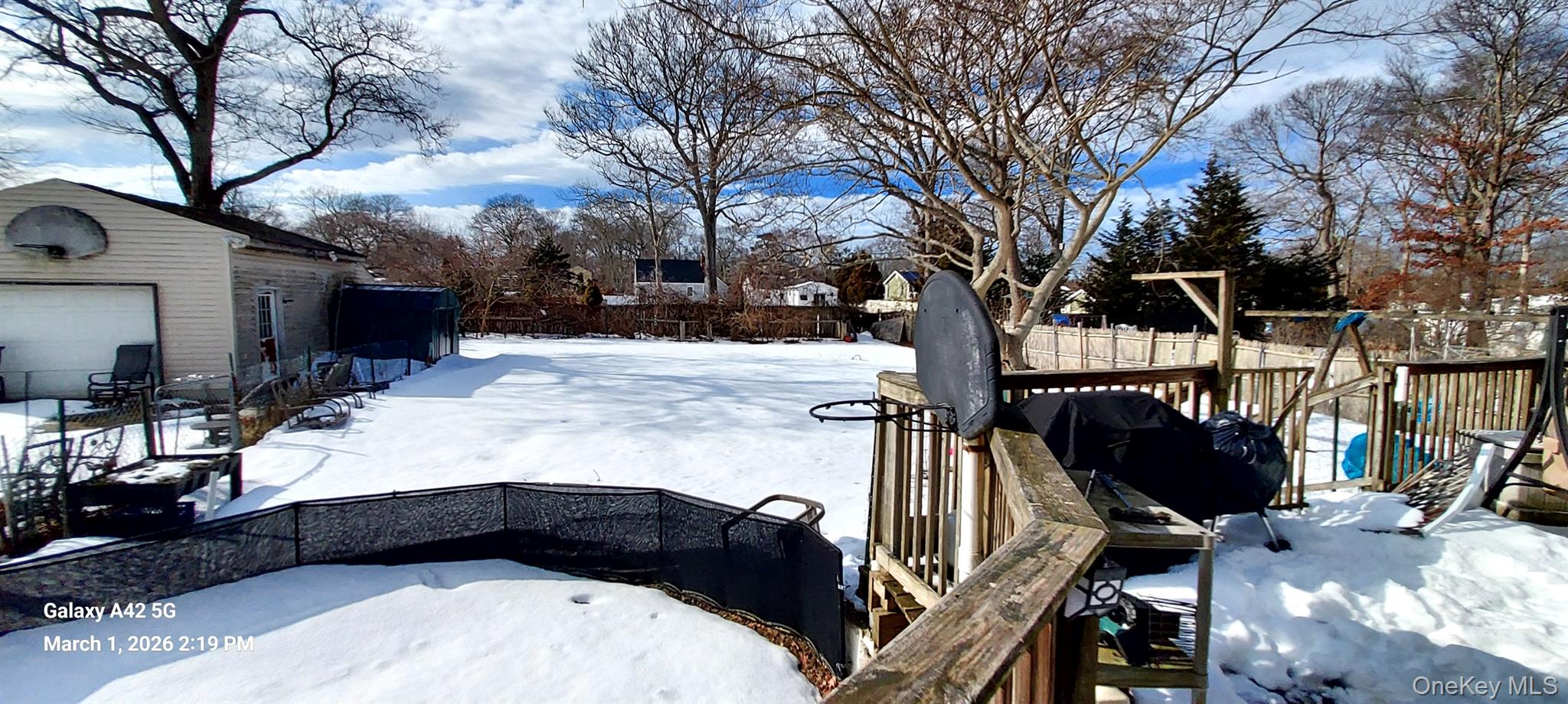120 Stackyard Drive Mastic Beach, NY 11951 - Photo 4 of 17 a view of a house with a yard
