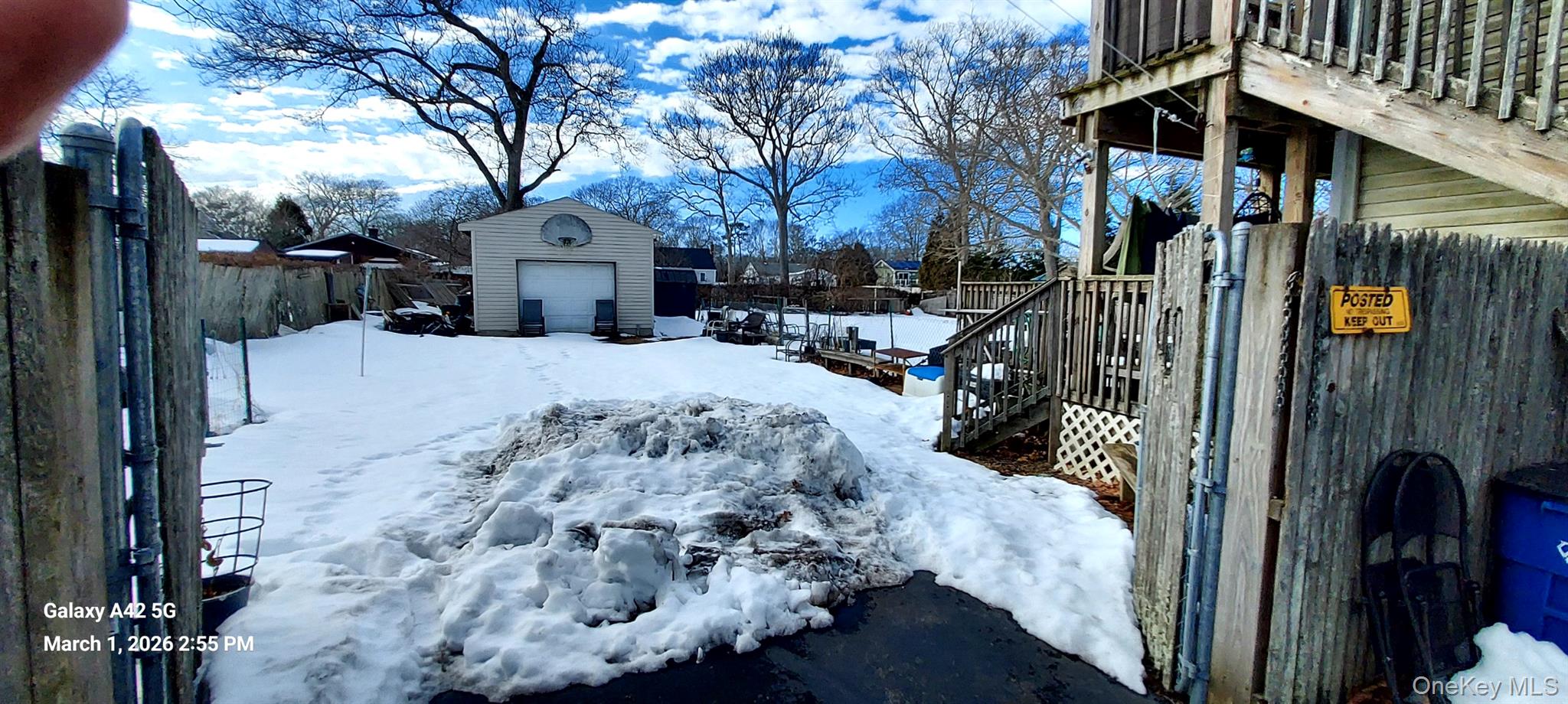 120 Stackyard Drive Mastic Beach, NY 11951 - Photo 5 of 17 a view of a house with a snow in the yard