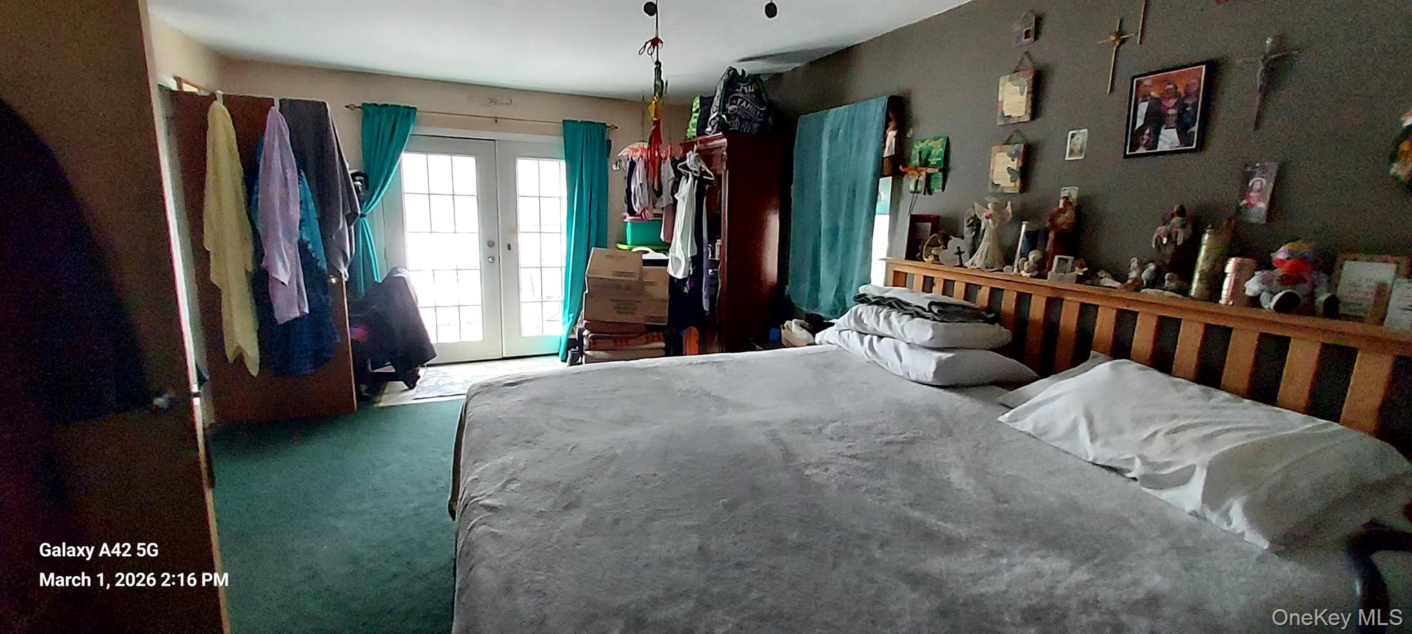 120 Stackyard Drive Mastic Beach, NY 11951 - Photo 7 of 17 a bed room with a bed and a window