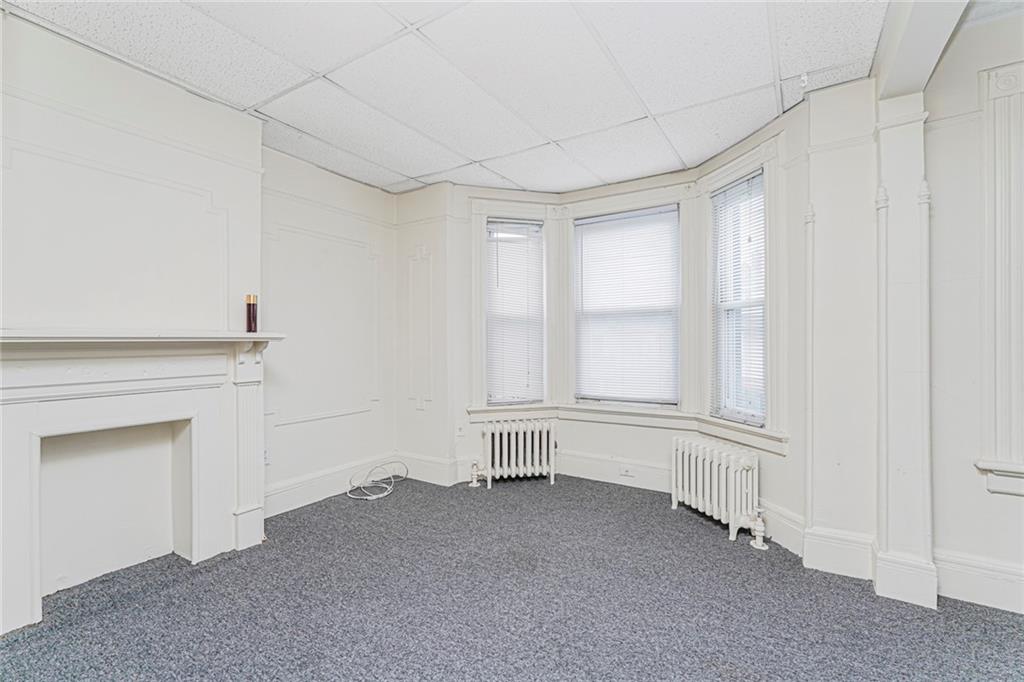 329 80th Street Brooklyn, NY 11209 - Photo 18 of 34 a view of an empty room with a window