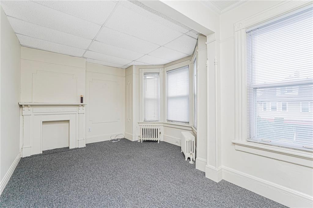 329 80th Street Brooklyn, NY 11209 - Photo 19 of 34 an empty room with a empty space and windows