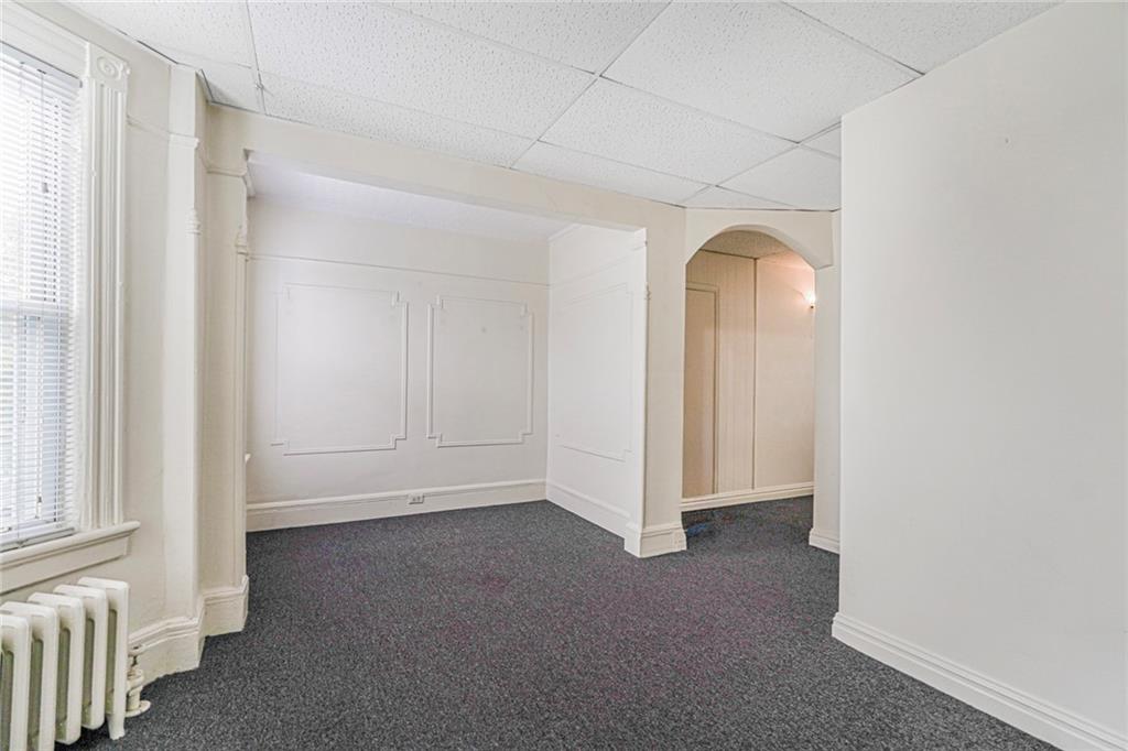 329 80th Street Brooklyn, NY 11209 - Photo 20 of 34 an empty room with a natural light