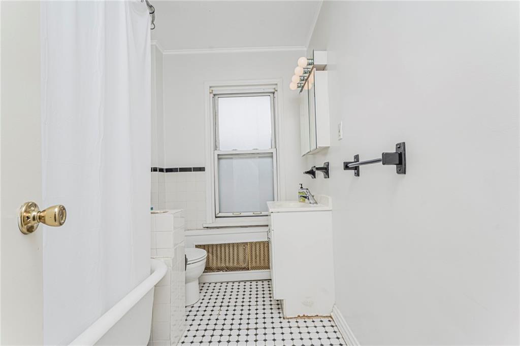 329 80th Street Brooklyn, NY 11209 - Photo 23 of 34 a bathroom with a shower