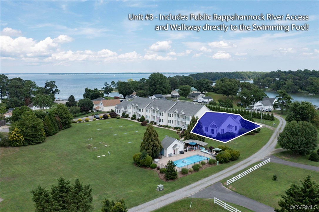 an aerial view of multiple house a big yard