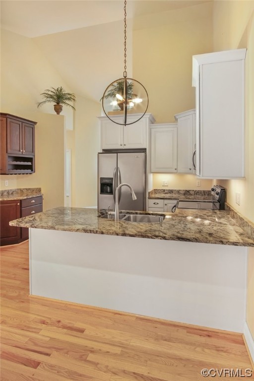 740 Marsh Pungo Road, Unit 8 Locust Hill, VA 23092 - Photo 12 of 50 a kitchen with kitchen island granite countertop a sink a counter top space and cabinets