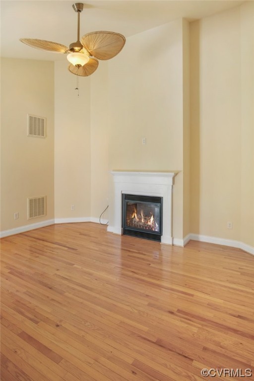 740 Marsh Pungo Road, Unit 8 Locust Hill, VA 23092 - Photo 14 of 50 a view of empty room with wooden floor and fireplace
