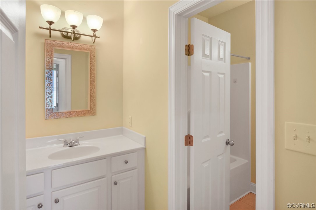 740 Marsh Pungo Road, Unit 8 Locust Hill, VA 23092 - Photo 16 of 50 a bathroom with a sink and a mirror