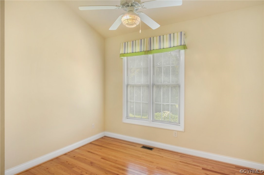 740 Marsh Pungo Road, Unit 8 Locust Hill, VA 23092 - Photo 17 of 50 a view of an empty room with wooden floor and a window