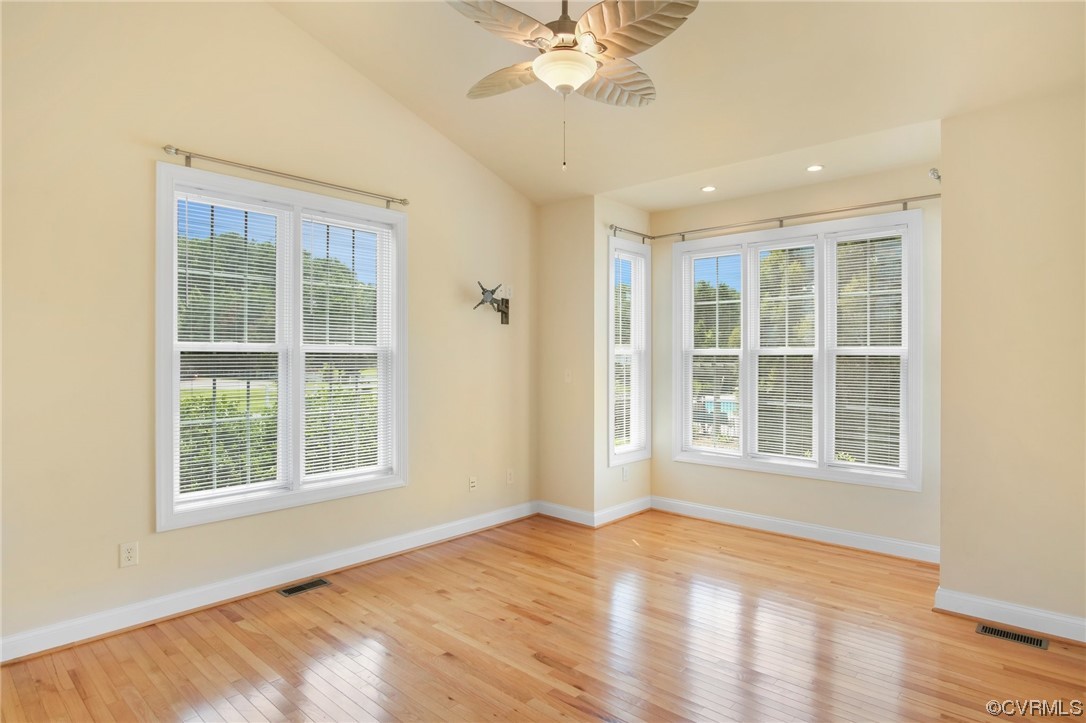 740 Marsh Pungo Road, Unit 8 Locust Hill, VA 23092 - Photo 22 of 50 an empty room with wooden floor and windows