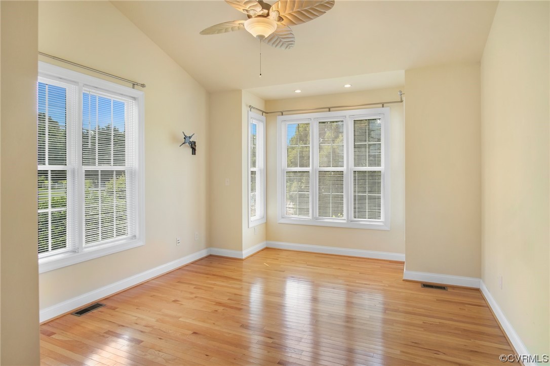 740 Marsh Pungo Road, Unit 8 Locust Hill, VA 23092 - Photo 23 of 50 an empty room with wooden floor and windows