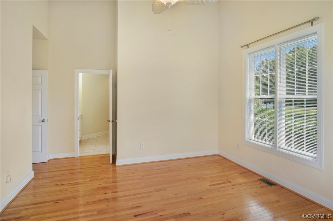 740 Marsh Pungo Road, Unit 8 Locust Hill, VA 23092 - Photo 24 of 50 a view of empty room with wooden floor and fan
