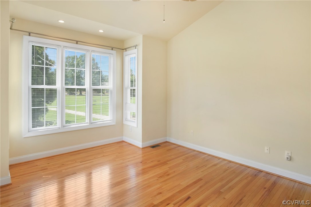 740 Marsh Pungo Road, Unit 8 Locust Hill, VA 23092 - Photo 27 of 50 an empty room with wooden floor and windows